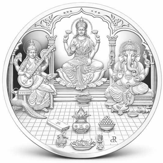 Decorative silver coin with three deities and intricate designs on a white background