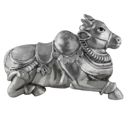 Silver decorative nandi figurine on a white background
