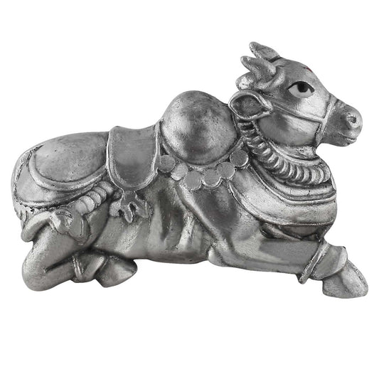 Silver decorative nandi figurine on a white background