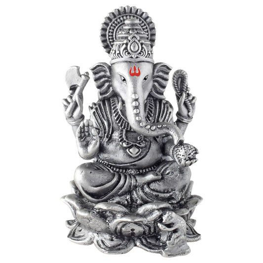 Silver statue of a deity ganesh with intricate details on a white background