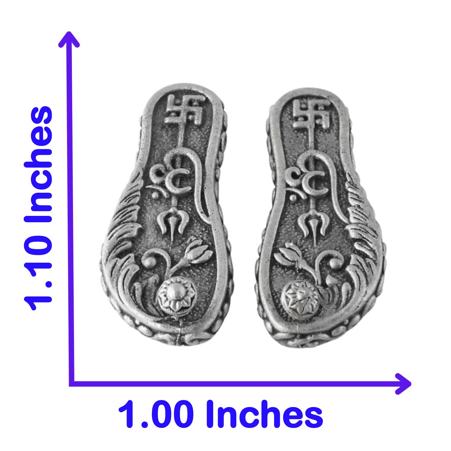Pair of silver laxmi paduka with intricate designs and measurements on a white background