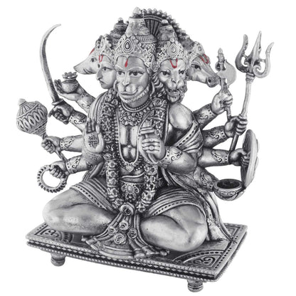 Statue of a multi-armed deity hanuman with various attributes on a white background