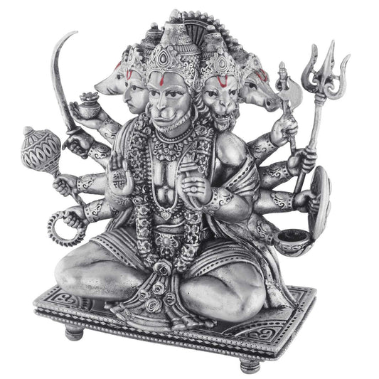 Statue of a multi-armed deity hanuman with various attributes on a white background