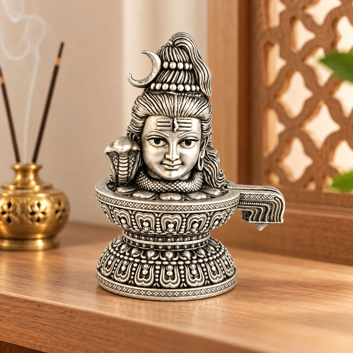 925 silver Lord Shiva face Shivling, 2 inch idol in a devotional setting