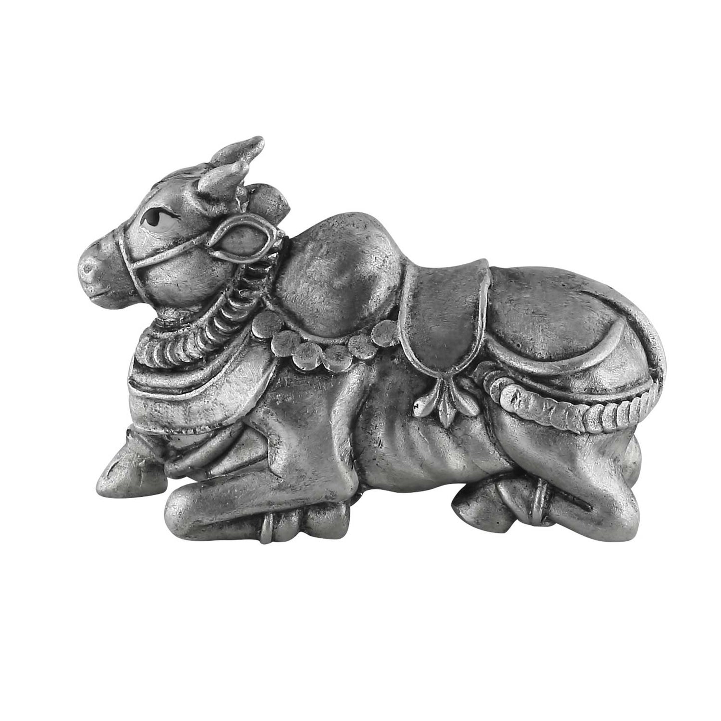 Decorative metal bull figurine with intricate details on a white background