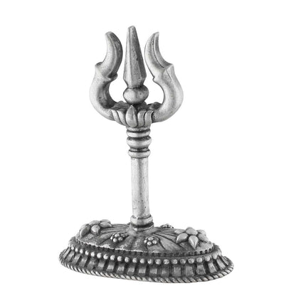 Decorative silver trident with intricate base on a white background