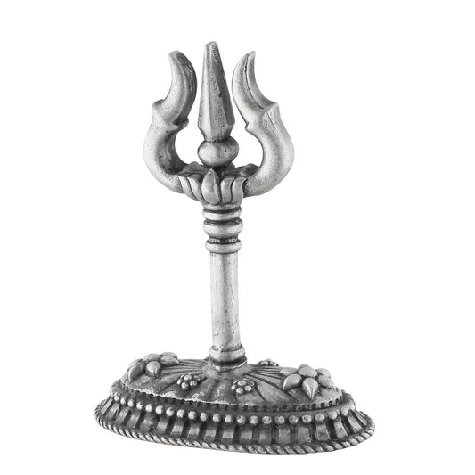 Decorative silver trident with intricate base on a white background